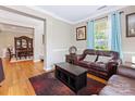 Comfortable living room features hardwood floors, natural light, and modern furnishings at 7325 Forrest Rader Dr, Mint Hill, NC 28227