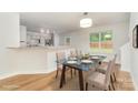 Open dining area featuring a modern table with seating for four and bright lighting at 1620 Crandon Dr, Charlotte, NC 28216