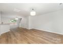 Spacious living area with hardwood floors leading to the staircase and second floor at 1620 Crandon Dr, Charlotte, NC 28216