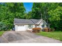 Ranch home featuring an attached garage and a spacious concrete driveway at 177 Candlestick Dr, Statesville, NC 28625