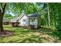 Charming single-story home with light siding, nestled in a lush, wooded lot at 177 Candlestick Dr, Statesville, NC 28625