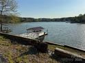 Picturesque view of a private boat dock on the tranquil lake, promising endless water adventures at 181 Edgewater Rd, Hickory, NC 28601