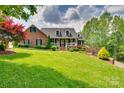 Stately brick home with a charming front porch and meticulously maintained lawn at 181 Edgewater Rd, Hickory, NC 28601