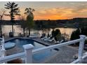 Stunning lakeside pool with a hot tub and ample lounge seating, perfect for enjoying sunsets at 181 Edgewater Rd, Hickory, NC 28601