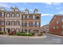 Beautiful brick townhome with well-maintained landscaping and lovely architectural details at 1948 Winpole Ln, Charlotte, NC 28273