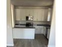 Modern kitchen featuring white cabinets, stainless steel appliances, and sleek countertops at 331 Nesbit Ave, Mooresville, NC 28115