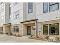 Modern townhome featuring a stylish brick facade with a gray and white color scheme at 834 Van Every St, Charlotte, NC 28205