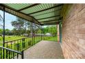 Spacious covered porch with iron railings offers a relaxing outdoor space at 975 22Nd Street Ne Pl, Hickory, NC 28601