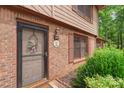 Charming entryway with a decorative door, brick facade, and manicured landscaping enhances curb appeal at 119 Mary Louise Ct, Fort Mill, SC 29715