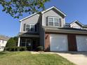Charming two-story home with a two-car garage, well-maintained lawn, and inviting curb appeal at 12120 Stratfield Place Cir, Pineville, NC 28134