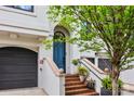 Stunning front entrance with brick steps, elegant railings, and a vibrant blue door at 208 Wendover Heights Cir, Charlotte, NC 28211