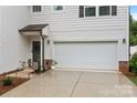 Close-up of the home's entry way showing the two car garage, door and front yard at 2535 Andes Dr, Statesville, NC 28625