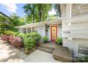 Close up of front door, plants, and brick facade at 3329 Winnipeg Cir, Charlotte, NC 28210