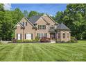 Charming brick home featuring manicured landscaping and an inviting front entrance at 3398 Millstone Creek Rd, Lancaster, SC 29720