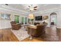 Cozy living room with coffered ceilings, hardwood floors, and a ceiling fan at 3398 Millstone Creek Rd, Lancaster, SC 29720