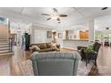 Spacious living room with hardwood floors, coffered ceiling, and an open floor plan at 3398 Millstone Creek Rd, Lancaster, SC 29720