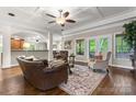Comfortable living room area featuring large windows, hardwood floors, and a seamless flow to dining at 3398 Millstone Creek Rd, Lancaster, SC 29720