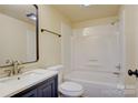 Bathroom featuring a bathtub, shower, updated vanity, and new commode at 405 Belva St, Kannapolis, NC 28081