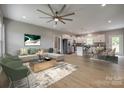 Open-concept living space featuring a modern kitchen, a dining area, and a comfortably furnished living room at 5705 White St, Fort Lawn, SC 29714