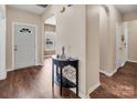 Welcoming entryway featuring wood floors, neutral walls, and a view into adjacent rooms at 10508 Madison Park Dr, Charlotte, NC 28269