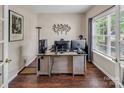 Bright office space with wood floors, large window, and ample room for a desk and computer setup at 10508 Madison Park Dr, Charlotte, NC 28269