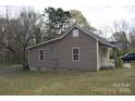 Single-story home featuring light siding, with a gable roof, and limited landscaping at 120 Mccleave Rd, China Grove, NC 28023