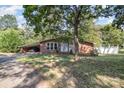 Charming brick home featuring a convenient covered carport and inviting front entrance at 1239 Christopher Cir, Rock Hill, SC 29730