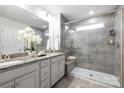 Elegant bathroom with a glass-enclosed shower, double vanity, and granite countertops at 145 Marron Dr, Indian Trail, NC 28079
