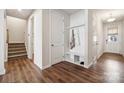 Inviting foyer with hardwood floors, a convenient mudroom bench, and ample closet space at 145 Marron Dr, Indian Trail, NC 28079