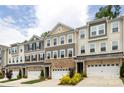 Attractive townhomes with stone accents, garages, and well-maintained landscaping at 145 Marron Dr, Indian Trail, NC 28079