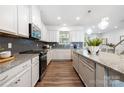 Modern kitchen featuring white cabinets, granite countertops, and stainless steel appliances at 145 Marron Dr, Indian Trail, NC 28079
