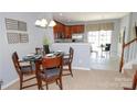 Cozy dining area with table setting next to the kitchen for easy serving at 175 Limerick Rd # C, Mooresville, NC 28115