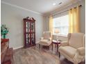 Cozy living room with hardwood floors, ample natural light, and decorative furnishings at 2037 Christopher Wood Ct, Indian Land, SC 29707