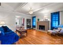 Bright living room features hardwood floors, fireplace, and an adjacent dining area at 218 5Th Se St, Hickory, NC 28602