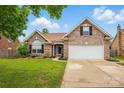 Traditional brick home with well-kept lawn, black shutters, and attached two-car garage at 3327 Flagler Cir, Midland, NC 28107