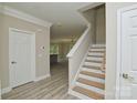 A spacious entryway and wood stairs at 4006 Scarlet Dr # 29, Matthews, NC 28104