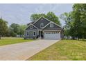 Charming two-story home with a well-manicured lawn and long driveway at 4006 Scarlet Dr # 29, Matthews, NC 28104