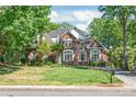 Charming brick home features lush landscaping and a well-maintained lawn at 4232 Shannamara Dr # 85, Matthews, NC 28104