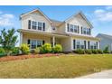 Beautiful exterior view of a two-story home with a well-manicured lawn at 4321 Hornyak Dr, Monroe, NC 28110