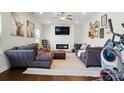 Spacious living room with a modern fireplace, recessed lighting, and plush furniture at 4321 Hornyak Dr, Monroe, NC 28110