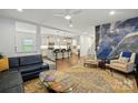 Open-concept living room showcasing modern decor, hardwood floors, and a seamless transition to the kitchen at 4506 S Potter Rd, Monroe, NC 28112