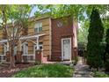 Attractive townhome with brick facade, lush lawn, and inviting front entrance at 510 N Alexander St, Charlotte, NC 28202