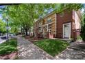 Street view of townhomes with mature trees, sidewalks, and well-kept lawns at 510 N Alexander St, Charlotte, NC 28202