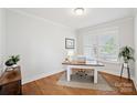 Well-lit home office with hardwood floors, a simple desk, and a window providing natural light at 528 Rock Skip Way, Fort Mill, SC 29708