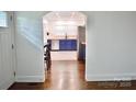 Open view of a modern kitchen featuring blue cabinets, butcher block countertops, and stainless steel appliances at 645 Wilshire Sw Ave, Concord, NC 28027
