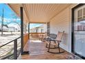 Cozy front porch featuring rocking chairs, and a charming wooden deck, perfect for relaxing outdoors at 803 N Walnut St, Kannapolis, NC 28081