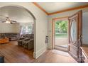 Open foyer with hardwood floors, showcasing an arched doorway leading to the living room at 828 N 6Th St, Albemarle, NC 28001
