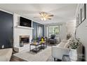 Cozy living room with a modern fireplace, neutral decor, and stylish accents at 8819 Kishorn Ct, Charlotte, NC 28215