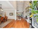 Bright foyer features hardwood floors, high ceilings, and seamless access to dining and living spaces at 8905 Landsdowne Ave, Harrisburg, NC 28075