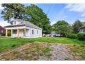 View of the rear of a home from the grass lot and landscaping behind the house at 906 Church St, Kings Mountain, NC 28086